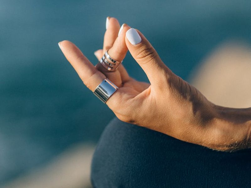 Close up of hands in a meditative pose.