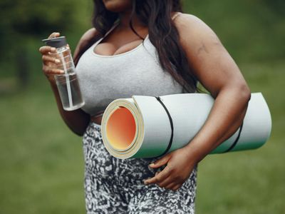 Rolled yoga mat and a bottle of water.